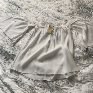 White off the shoulder flowy top.